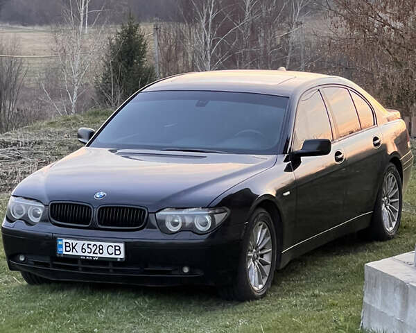 Чорний БМВ 7 Серія, об'ємом двигуна 2.99 л та пробігом 438 тис. км за 6600 $, фото 1 на Automoto.ua