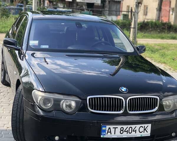 Черный БМВ 7 Серия, объемом двигателя 2.99 л и пробегом 366 тыс. км за 6100 $, фото 1 на Automoto.ua