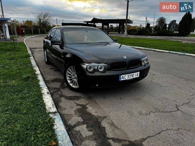 Черный БМВ 7 Серия, объемом двигателя 2.99 л и пробегом 446 тыс. км за 6500 $, фото 1 на Automoto.ua