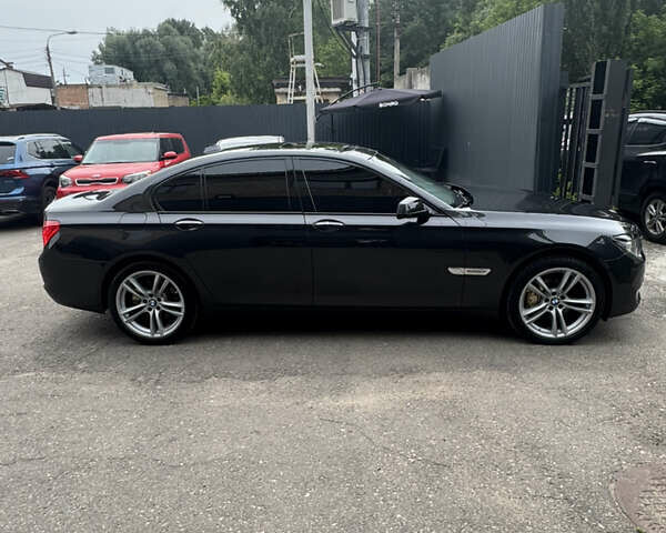 Черный БМВ 7 Серия, объемом двигателя 2.99 л и пробегом 360 тыс. км за 17500 $, фото 1 на Automoto.ua