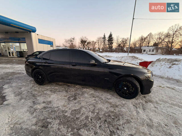 Черный БМВ 7 Серия, объемом двигателя 3 л и пробегом 180 тыс. км за 18999 $, фото 1 на Automoto.ua