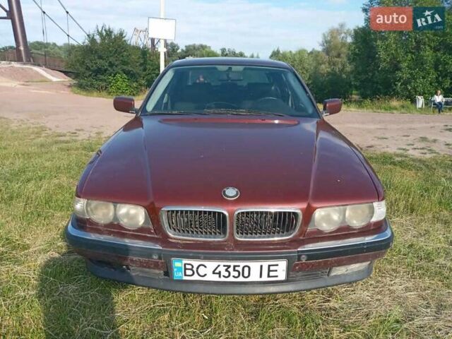 Красный БМВ 7 Серия, объемом двигателя 2.8 л и пробегом 240 тыс. км за 3650 $, фото 1 на Automoto.ua