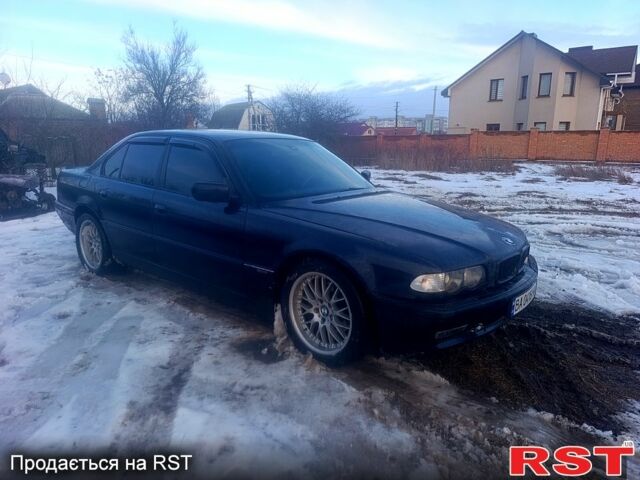 Синий БМВ 7 Серия, объемом двигателя 3.5 л и пробегом 300 тыс. км за 4200 $, фото 1 на Automoto.ua