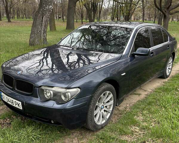 Синий БМВ 7 Серия, объемом двигателя 3.6 л и пробегом 242 тыс. км за 5800 $, фото 1 на Automoto.ua