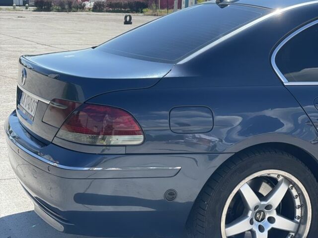 Синій БМВ 7 Серія, об'ємом двигуна 4 л та пробігом 389 тис. км за 6660 $, фото 1 на Automoto.ua