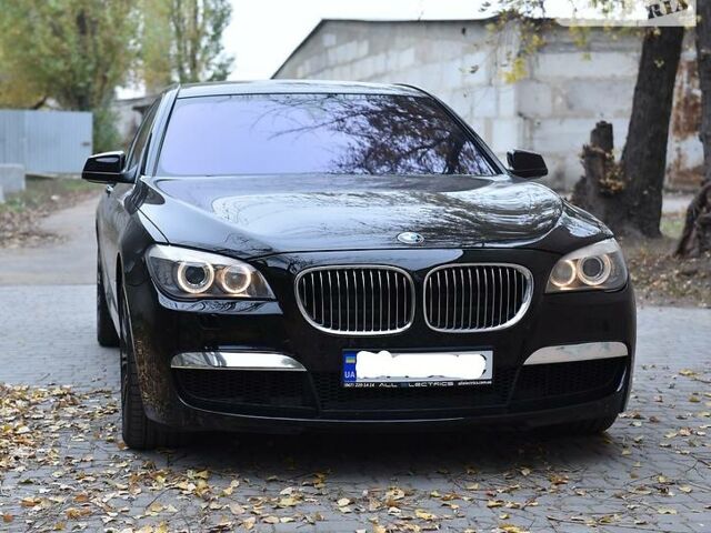 Чорний БМВ 740, об'ємом двигуна 3 л та пробігом 110 тис. км за 28700 $, фото 1 на Automoto.ua