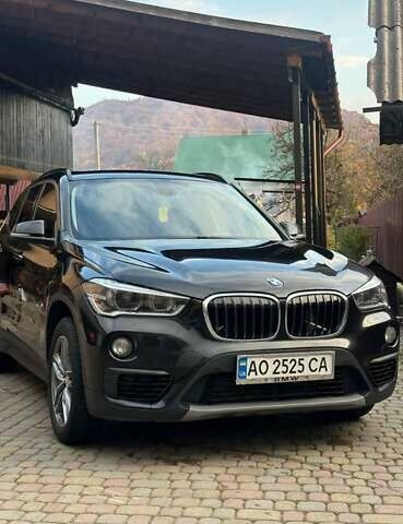 Черный БМВ Х1, объемом двигателя 2 л и пробегом 241 тыс. км за 19555 $, фото 1 на Automoto.ua