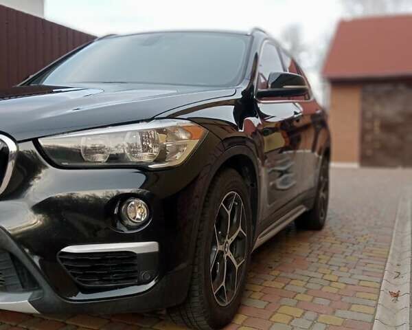 Чорний БМВ Х1, об'ємом двигуна 2 л та пробігом 125 тис. км за 13999 $, фото 1 на Automoto.ua