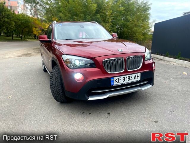 Красный БМВ Х1, объемом двигателя 2 л и пробегом 400 тыс. км за 12000 $, фото 1 на Automoto.ua