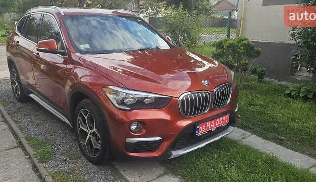 Оранжевый БМВ Х1, объемом двигателя 2 л и пробегом 65 тыс. км за 21600 $, фото 1 на Automoto.ua