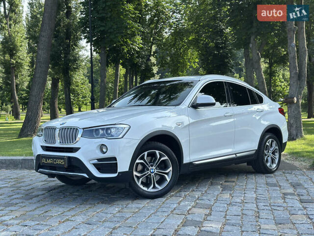 Белый БМВ Х4, объемом двигателя 2 л и пробегом 63 тыс. км за 27700 $, фото 1 на Automoto.ua