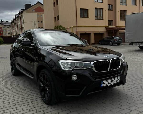Черный БМВ Х4, объемом двигателя 2 л и пробегом 150 тыс. км за 21000 $, фото 1 на Automoto.ua
