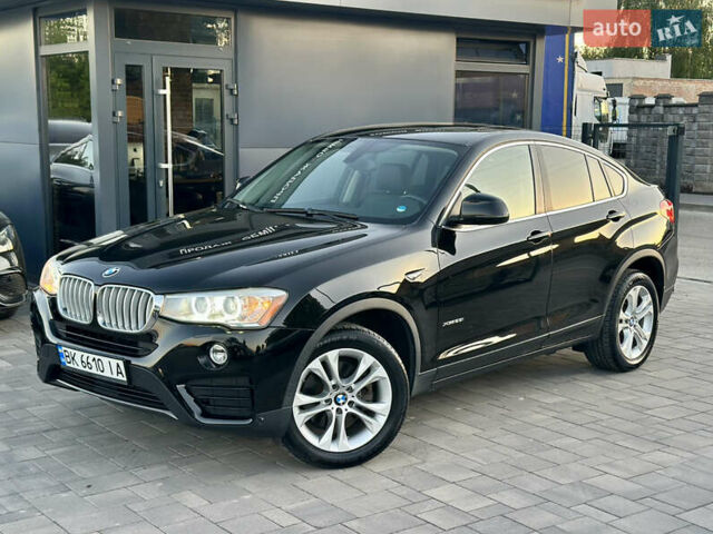 Черный БМВ Х4, объемом двигателя 2 л и пробегом 97 тыс. км за 19500 $, фото 1 на Automoto.ua