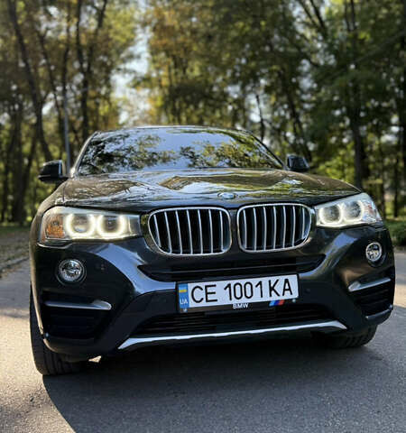 Черный БМВ Х4, объемом двигателя 2 л и пробегом 171 тыс. км за 27700 $, фото 1 на Automoto.ua