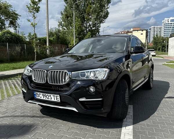 Черный БМВ Х4, объемом двигателя 2 л и пробегом 128 тыс. км за 26999 $, фото 1 на Automoto.ua