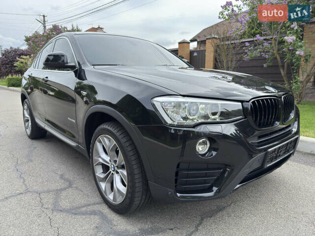 Черный БМВ Х4, объемом двигателя 2 л и пробегом 91 тыс. км за 25700 $, фото 1 на Automoto.ua