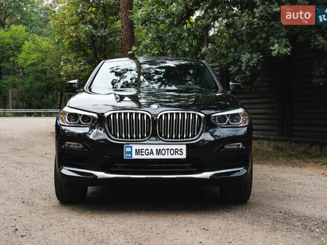 Черный БМВ Х4, объемом двигателя 2 л и пробегом 65 тыс. км за 39990 $, фото 1 на Automoto.ua