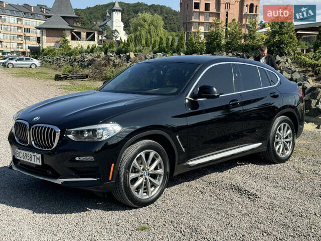 Черный БМВ Х4, объемом двигателя 2 л и пробегом 104 тыс. км за 37750 $, фото 1 на Automoto.ua