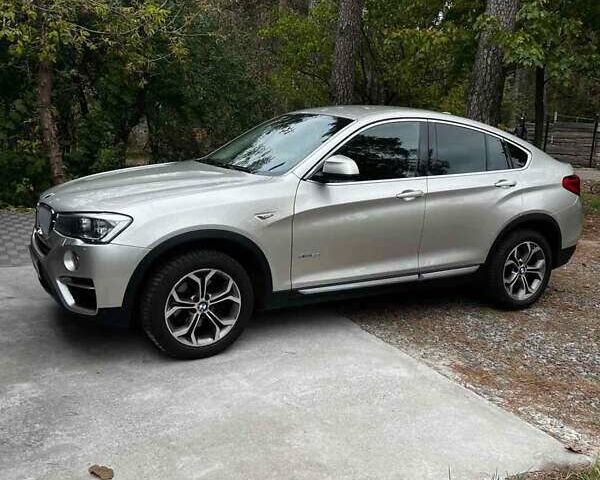 Серый БМВ Х4, объемом двигателя 2 л и пробегом 96 тыс. км за 37500 $, фото 1 на Automoto.ua
