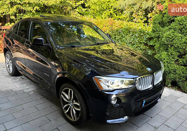 Синий БМВ Х4, объемом двигателя 2 л и пробегом 91 тыс. км за 29500 $, фото 1 на Automoto.ua