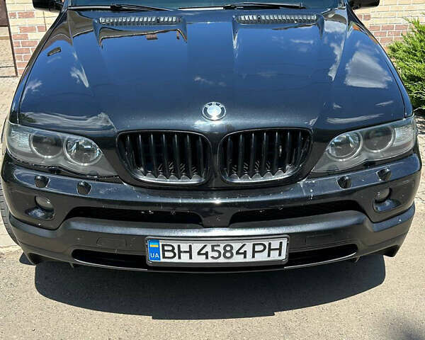 Черный БМВ Х5, объемом двигателя 4.4 л и пробегом 329 тыс. км за 7999 $, фото 1 на Automoto.ua