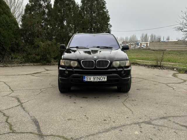 Черный БМВ Х5, объемом двигателя 3 л и пробегом 400 тыс. км за 4999 $, фото 1 на Automoto.ua