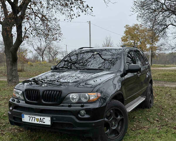 Черный БМВ Х5, объемом двигателя 2.98 л и пробегом 404 тыс. км за 9500 $, фото 1 на Automoto.ua