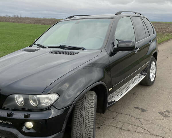 Черный БМВ Х5, объемом двигателя 2.99 л и пробегом 244 тыс. км за 12000 $, фото 1 на Automoto.ua