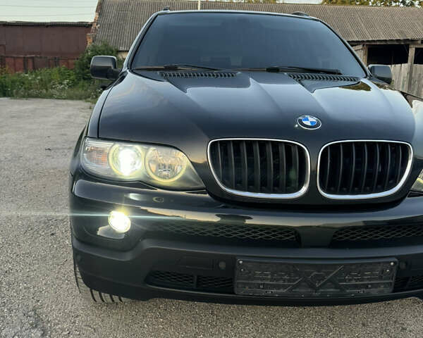 Чорний БМВ Х5, об'ємом двигуна 3 л та пробігом 320 тис. км за 12999 $, фото 1 на Automoto.ua