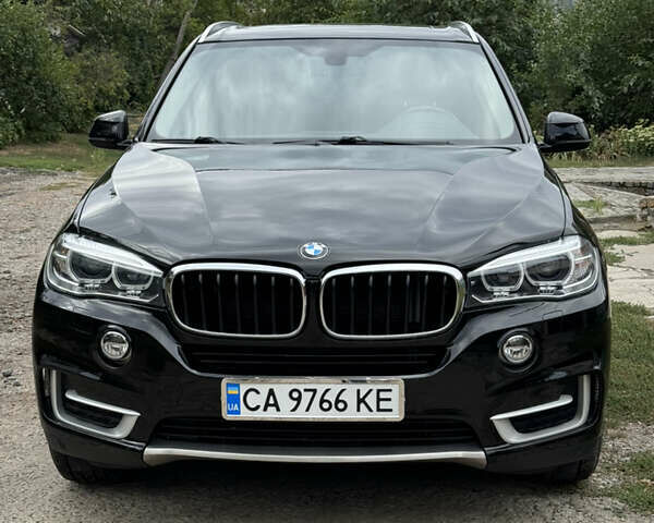Черный БМВ Х5, объемом двигателя 3 л и пробегом 170 тыс. км за 32500 $, фото 1 на Automoto.ua