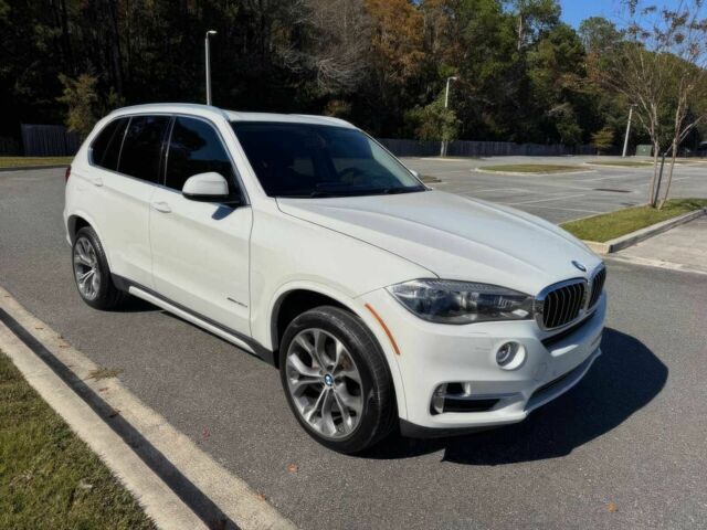 Чорний БМВ Х5, об'ємом двигуна 3 л та пробігом 73 тис. км за 14600 $, фото 1 на Automoto.ua