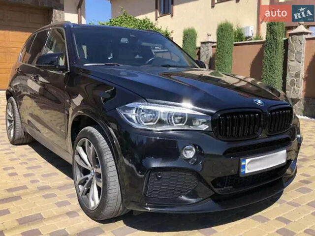 Черный БМВ Х5, объемом двигателя 2 л и пробегом 106 тыс. км за 39000 $, фото 1 на Automoto.ua