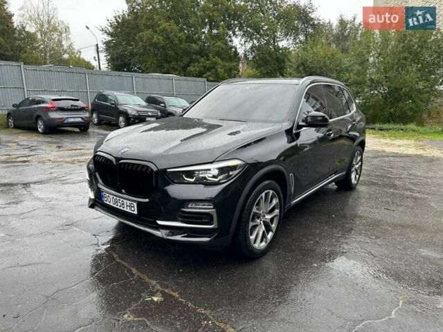 Черный БМВ Х5, объемом двигателя 3 л и пробегом 74 тыс. км за 57500 $, фото 1 на Automoto.ua