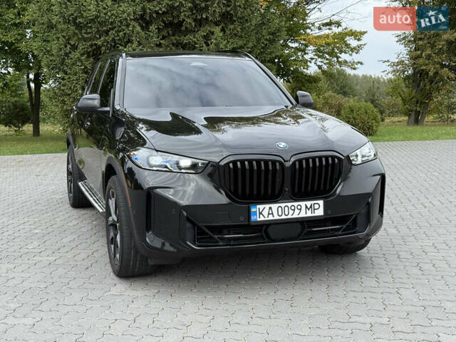 Черный БМВ Х5, объемом двигателя 3 л и пробегом 75 тыс. км за 72800 $, фото 1 на Automoto.ua