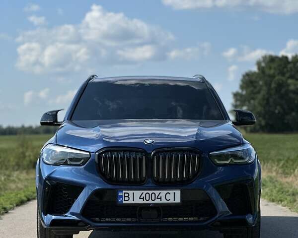 Синий БМВ Х5, объемом двигателя 3 л и пробегом 70 тыс. км за 48799 $, фото 1 на Automoto.ua
