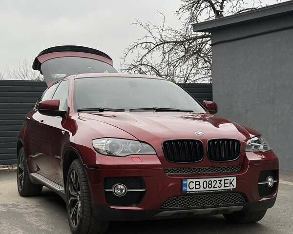 Красный БМВ Х6, объемом двигателя 3 л и пробегом 182 тыс. км за 15550 $, фото 1 на Automoto.ua