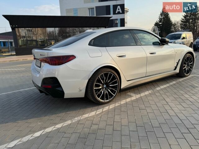 Белый БМВ i4, объемом двигателя 0 л и пробегом 12 тыс. км за 48500 $, фото 1 на Automoto.ua