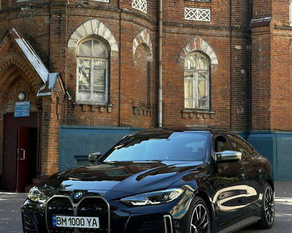 Черный БМВ i4, объемом двигателя 0 л и пробегом 33 тыс. км за 52000 $, фото 1 на Automoto.ua