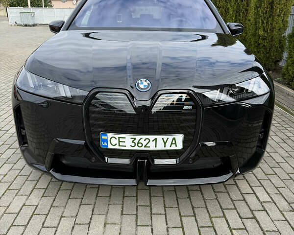 Черный БМВ iX, объемом двигателя 0 л и пробегом 40 тыс. км за 61088 $, фото 1 на Automoto.ua