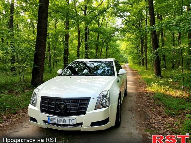 Белый Кадиллак СТС, объемом двигателя 3 л и пробегом 183 тыс. км за 7700 $, фото 1 на Automoto.ua