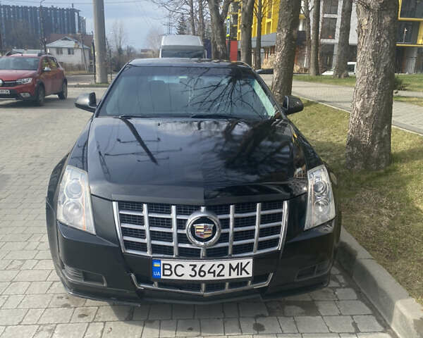 Чорний Каділак CTS, об'ємом двигуна 2.99 л та пробігом 197 тис. км за 10500 $, фото 1 на Automoto.ua