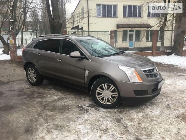 Бронзовий Каділак SRX, об'ємом двигуна 3 л та пробігом 120 тис. км за 19999 $, фото 1 на Automoto.ua