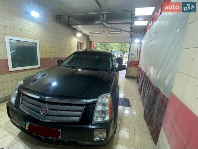 Чорний Каділак SRX, об'ємом двигуна 4.6 л та пробігом 150 тис. км за 9000 $, фото 1 на Automoto.ua