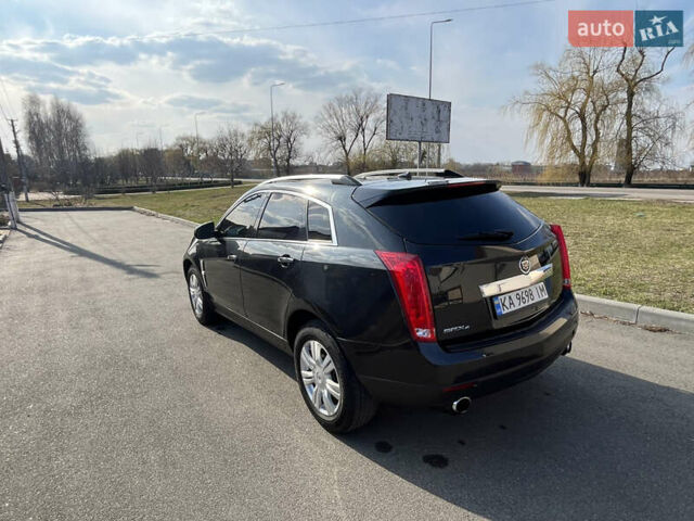 Черный Кадиллак СРХ, объемом двигателя 3 л и пробегом 300 тыс. км за 9000 $, фото 1 на Automoto.ua