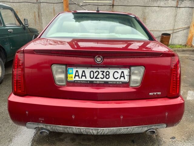 Красный Кадиллак STS, объемом двигателя 3.6 л и пробегом 200 тыс. км за 4300 $, фото 1 на Automoto.ua