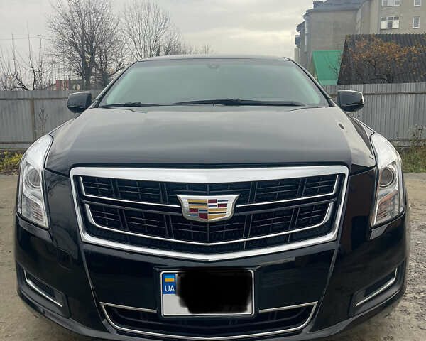 Черный Кадиллак ХТС, объемом двигателя 3.56 л и пробегом 275 тыс. км за 15600 $, фото 1 на Automoto.ua
