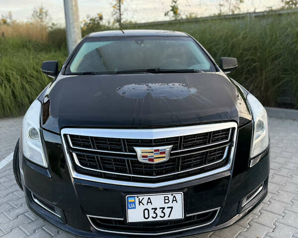 Черный Кадиллак ХТС, объемом двигателя 3.56 л и пробегом 270 тыс. км за 15000 $, фото 1 на Automoto.ua