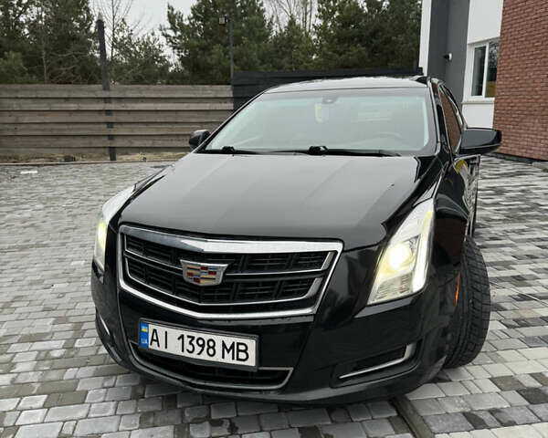 Черный Кадиллак ХТС, объемом двигателя 3.56 л и пробегом 330 тыс. км за 16000 $, фото 1 на Automoto.ua