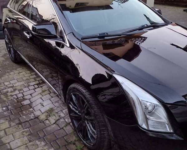 Чорний Каділак ХТС, об'ємом двигуна 3.65 л та пробігом 175 тис. км за 14500 $, фото 1 на Automoto.ua