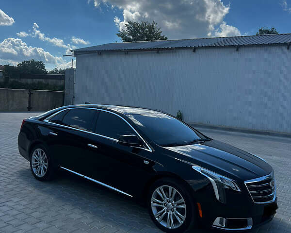 Черный Кадиллак ХТС, объемом двигателя 3.6 л и пробегом 97 тыс. км за 26500 $, фото 1 на Automoto.ua